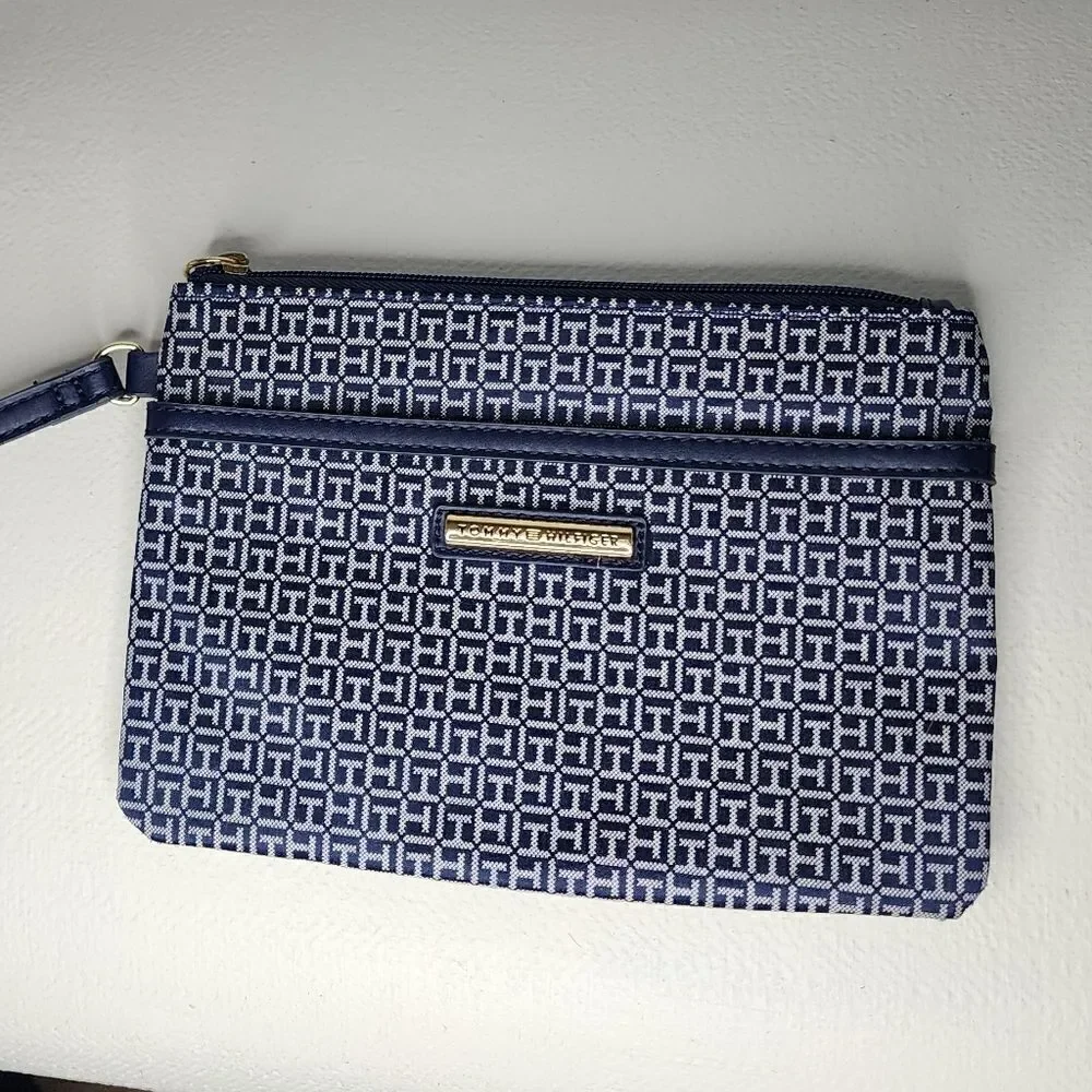Tommy Hilfiger Wristlet Blue And White with red accents.